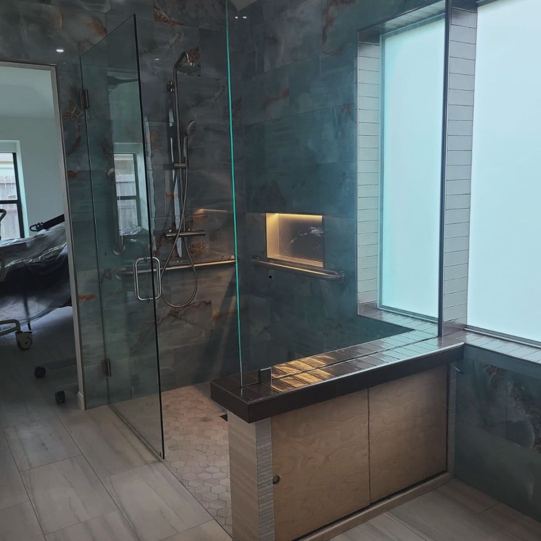 After luxury bathroom remodel with glass shower and illumination