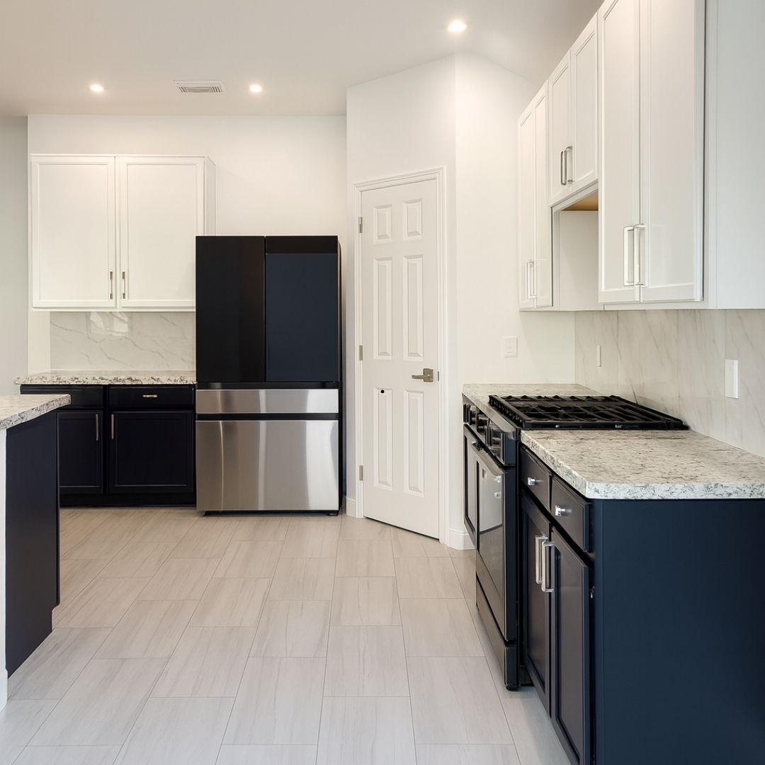 After kitchen remodel in Houston with two-tone cabinets and new flooring